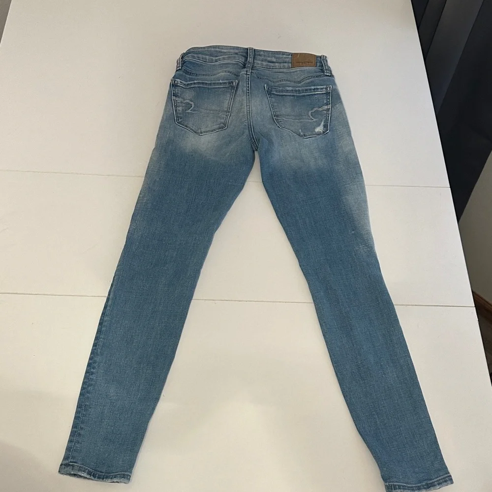 American Eagle Outfitters Light Blue Distressed Skinny Jeans - Picture 9 of 11